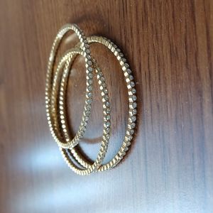 Three Gold Tone Bangles With Crystals